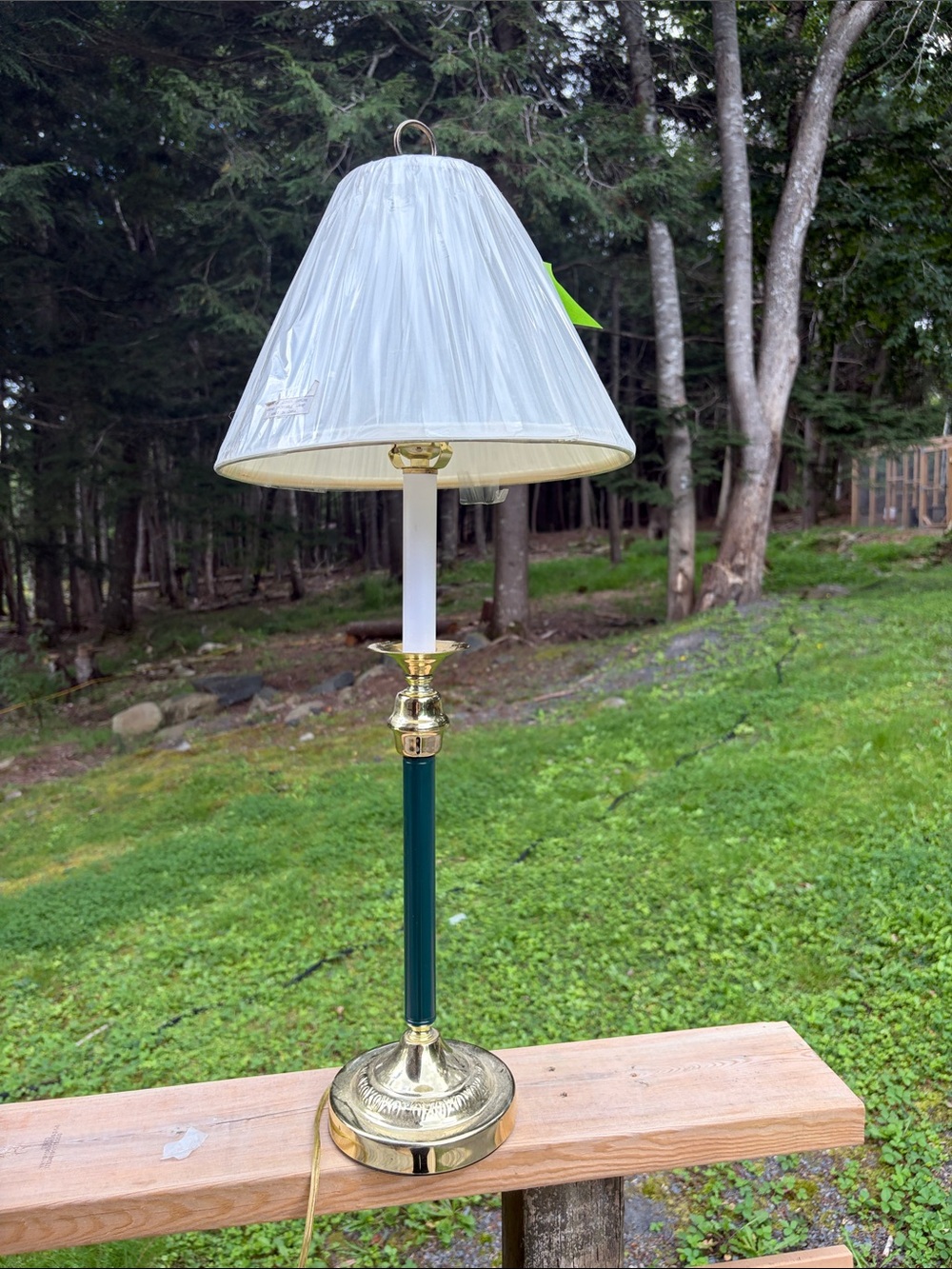 Vintage 1980s brass and dark green buffet lamp. Shade still partially covered.